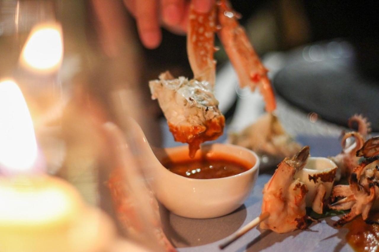 The Shore At Katathani - Adult Only - Sha Extra Plus Екстериор снимка A prawn being dipped into a bowl of cocktail sauce