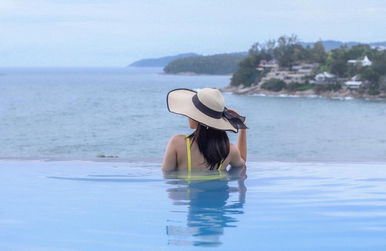 The Shore At Katathani - Adult Only - Sha Extra Plus Екстериор снимка A woman wearing a sun hat